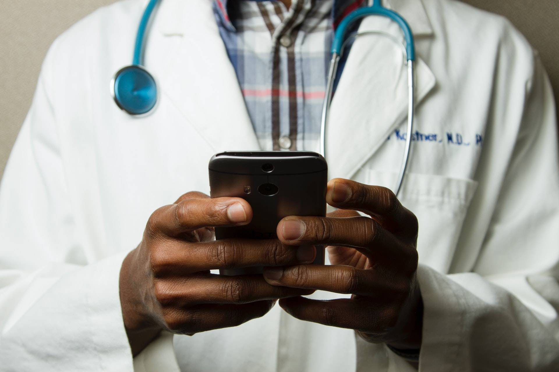 A doctor testing using a mobile phone - Dato Darren Yaw