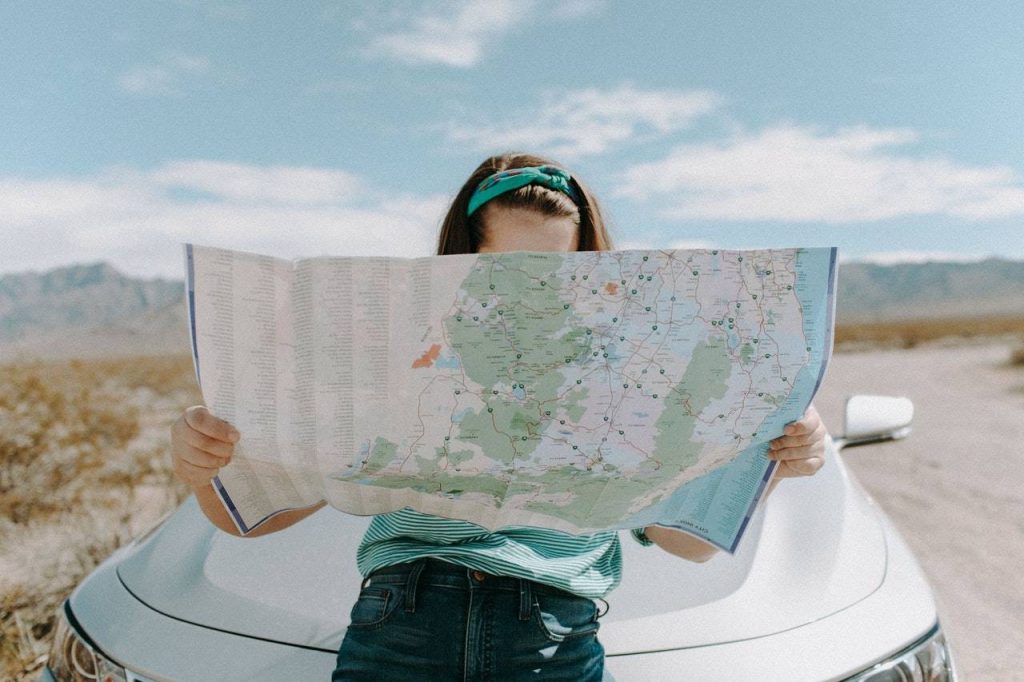 a woman holding a map - Dato Darren Yaw
