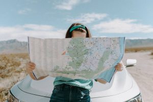 a woman holding a map - Dato Darren Yaw