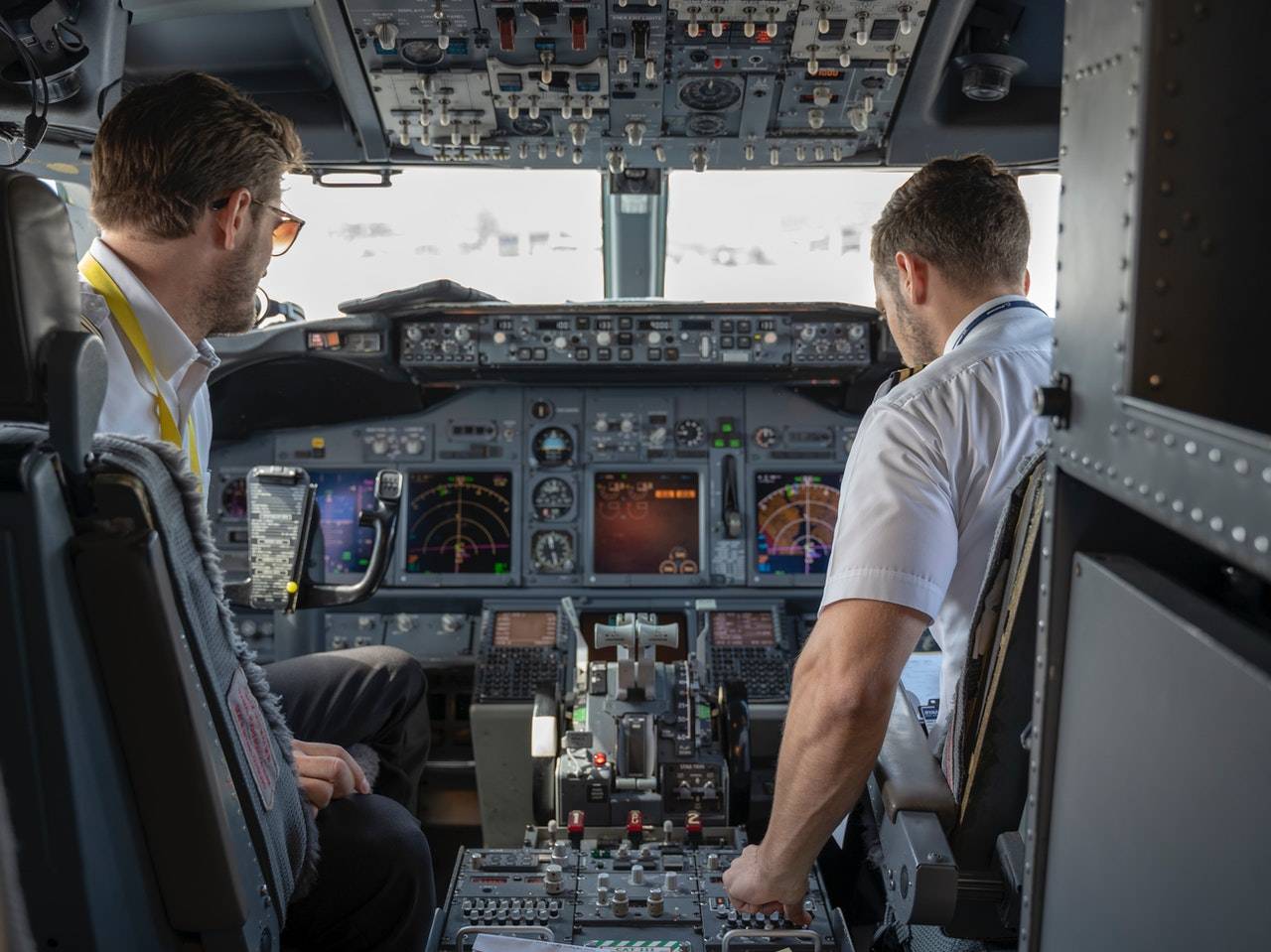 two pilots in a cockpit - Darren Yaw